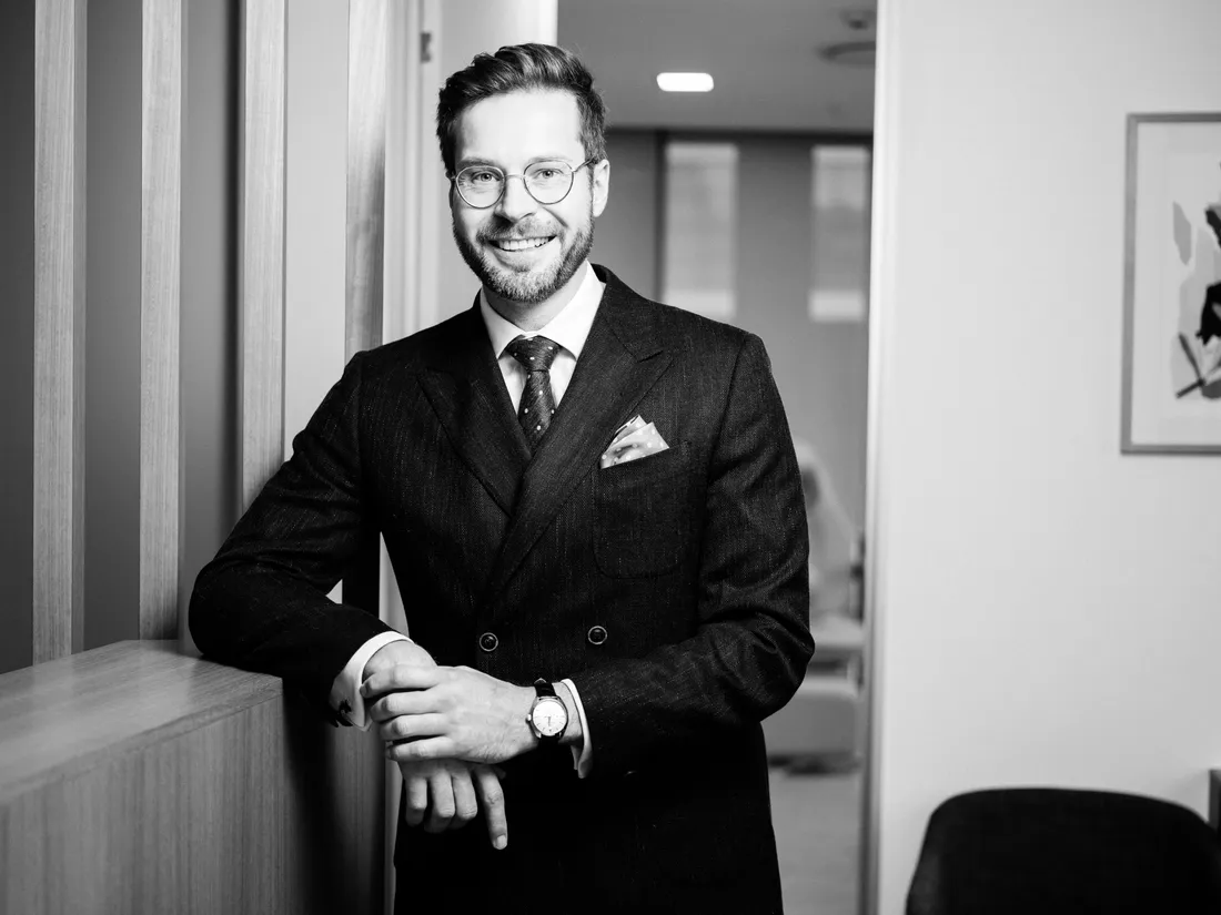 Portrait of Dr Chris Oosthuizen in a dark suit